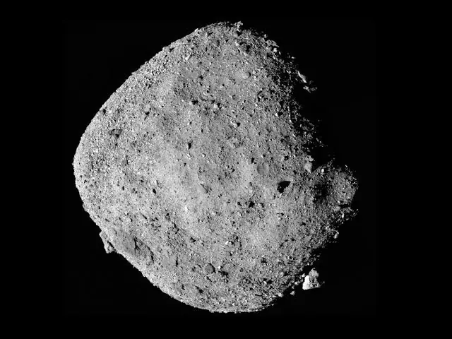 Black-and-white mosaic of the rubble-covered, diamond-shaped asteroid Bennu against black space