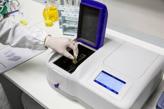 A spectrophotometer with a cuvette holder, used to measure absorbance at a chosen wavelength